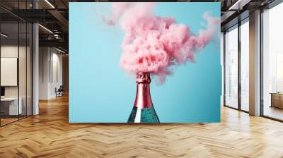 Champagne explosion on blue background. Glass wine bottle with beautiful pink smoke for celebration Christmas or New Year. Minimal party concept. Holiday card, banner, flyer with copy space Wall mural