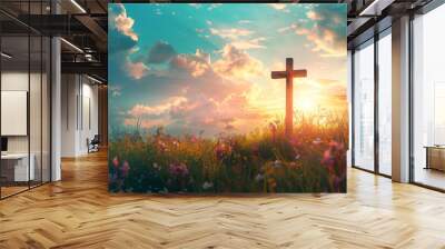 Christian cross on beautiful spring field with flowers at sunrise. Resurrection of Jesus, crucifixion. Easter morning, Good Friday. Peace and hope. Religion and christianity concept Wall mural