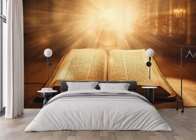 Holy Bible with candle on sunny blurred background. Abstract antique magic open book. Religious belief, faith and worship. Religion concept Wall mural