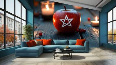 Pagan star shaped symbol on red apple on dark background with berries and burning candles. Mabon sabbat, Samhain, Yule. Autumn equinox holiday. Wiccan pagan religion. Magic esoteric spiritual ritual Wall mural