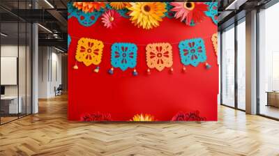 String of handmade cut paper flags on red background with colorful flowers and tropical leaves. Mexican party decoration. Dia de los Muertos, Halloween, Cinco de Mayo Wall mural