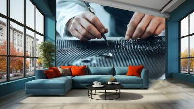 Close up view of a control technician carefully inspecting carbon fiber strands for consistency and during the manufacturing process Wall mural