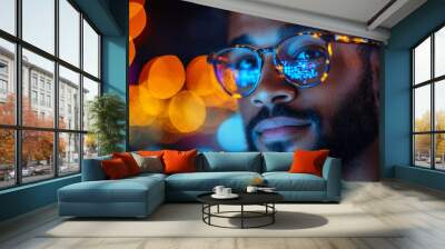 A software engineer providing technical support on laptop, showcasing focused expression amidst vibrant, illuminated background. colorful bokeh enhances tech savvy atmosphere Wall mural