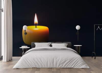 single candle flame flickers softly against dark grey background, creating warm and inviting atmosphere. glow of yellow candle adds touch of serenity and calmness to scene Wall mural