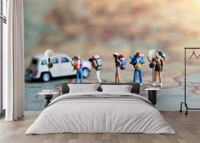 Miniature backpacker on map with car, Concept of Travel around the world and the adventure. Wall mural