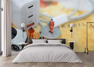 Miniature Figures and Electric Car Charging Station. Wall mural