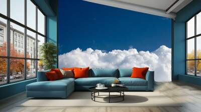 blue sky and white cloudy top view above the clouds with copy space . small plane Wall mural