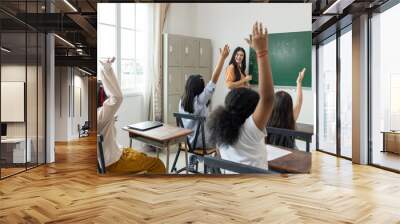 A group of children are in a classroom with a teacher Wall mural