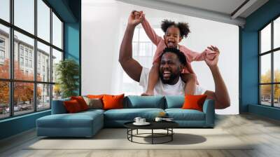 enjoy happy love black family african american father carrying daughter little african girl child smiling and having fun moments good time.  American father day concept. Wall mural