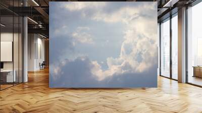 The sky is cloudy and the sun is shining through the clouds Wall mural