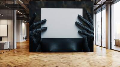 Black hand of evil witch with white paper, copy space for texting. Wall mural