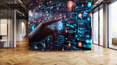 A hand is pointing at a computer screen with a blue and orange background. Concept of technology and innovation, as the hand is interacting with the digital display Wall mural