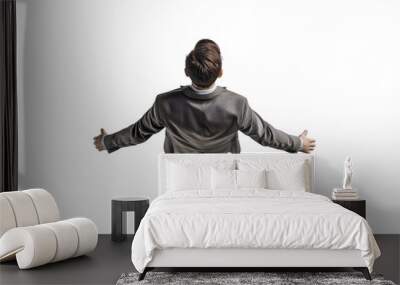 Overhead view of a person with open arms in casual attire on a black background, symbolizing freedom and welcome. Wall mural