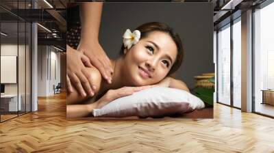 Asian woman having massage and spa salon Beauty treatment concept Wall mural