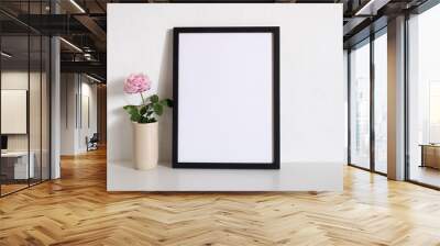 mock up black frame picture with flower on table Wall mural