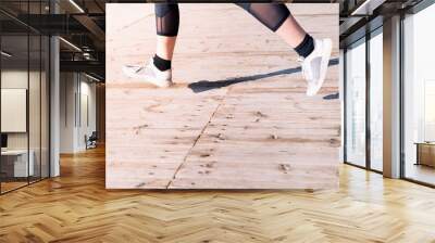 female runner's legs jogging in sneakers Wall mural