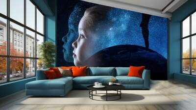 A little girl is looking at the starry sky Wall mural