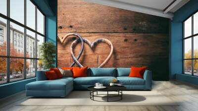 3d rendering joined hearts on wooden background Wall mural