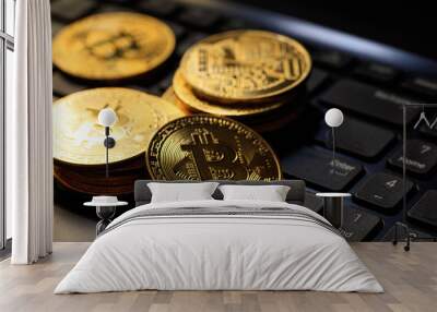 Bitcoins on a black laptop Wall mural