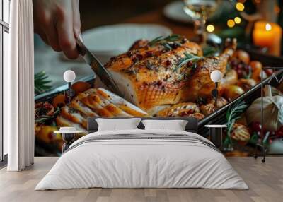 Christmas and thanksgiving holiday dinner, cutting roasted turkey on the festive table, closeup.  Wall mural