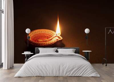 Diwali, Hindu festival of lights celebration. Diya oil lamp against dark background, Wall mural