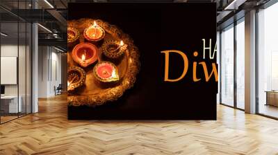 Diwali, Hindu festival of lights celebration. Diya oil lamps against dark background, Wall mural