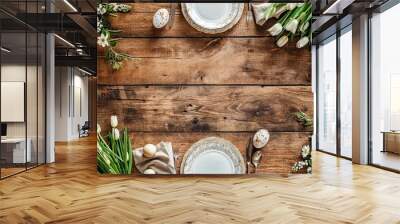 Easter table setting, easter eggs and flowers decoration on wooden background, top view Wall mural