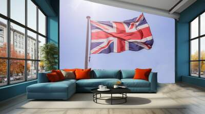 Great Britain flag waving against clear blue sky Wall mural