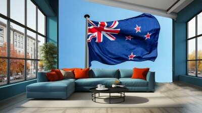 New Zealand flag waving against clear blue sky Wall mural