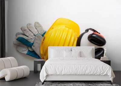 Safety equipment helmet gloves and ear muffs isolated on white background. Personal protective gear Wall mural