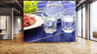 Two glasses of ouzo and appetizers Wall mural