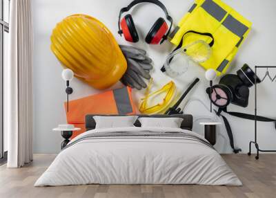 Work safety protection equipment background. Industrial protective gear on white Wall mural