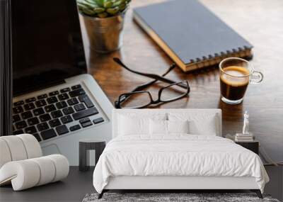 Workplace. Computer laptop and mobile phone on a wood office desk Wall mural