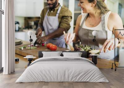 A couple is cooking in the kitchen together Wall mural