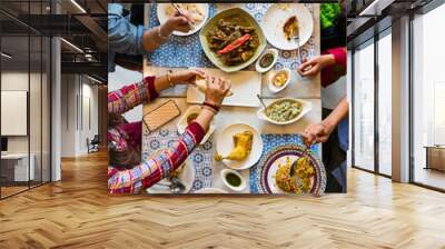 A group of Indian people is having lunch together Wall mural