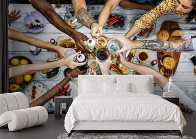 Aerial view of diverse hands clinking beverage together Wall mural