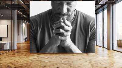 African American man resting his chin on his hands Wall mural