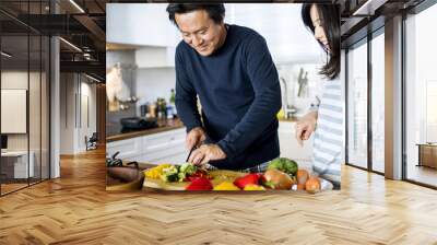 Asian couple cooking in the kitchen Wall mural