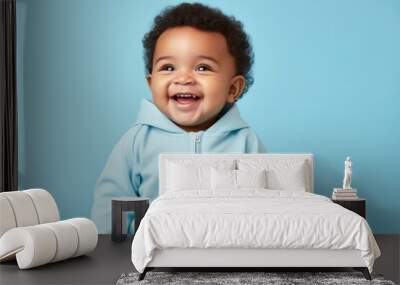 Baby smile blue blue background. Wall mural