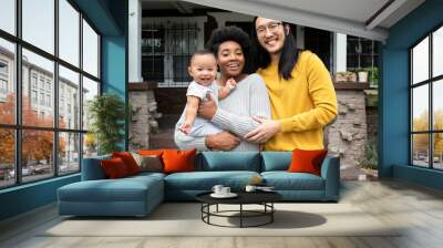 Beautiful multiethnic family standing at the porch during covid19 lockdown Wall mural