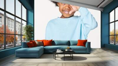 Black boy wearing blue sweater in studio Wall mural