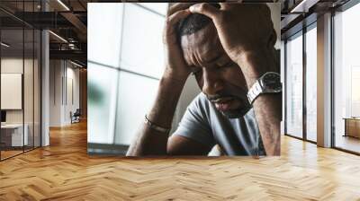 Black guy stressting and headache Wall mural