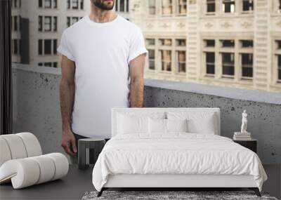 Casual white t-shirt man in the city apparel shoot Wall mural