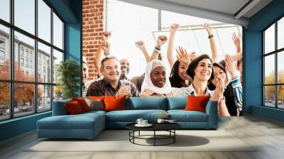 Cheerful diverse people in a workshop Wall mural