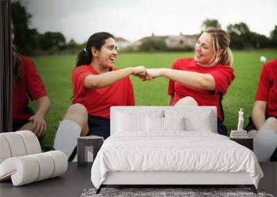 Cheerful rugby players doing a fist bump Wall mural