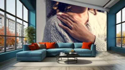 Cheerful woman with engagement ring Wall mural