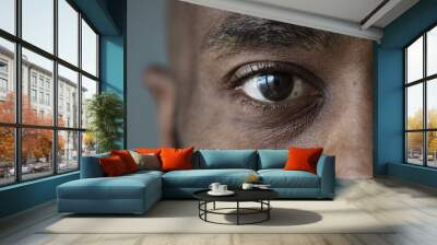 Closeup of an eye of a black man Wall mural