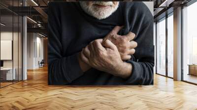 Closeup of elderly man having heart attack chest pain Wall mural