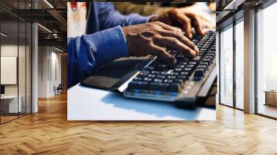 Closeup of hands working on computer keyboard Wall mural