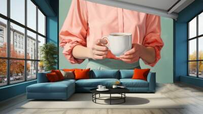 Coffee cup holding drink. Wall mural